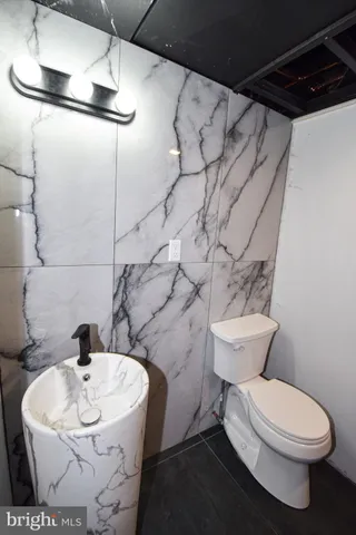 a bathroom with a sink and a toilet