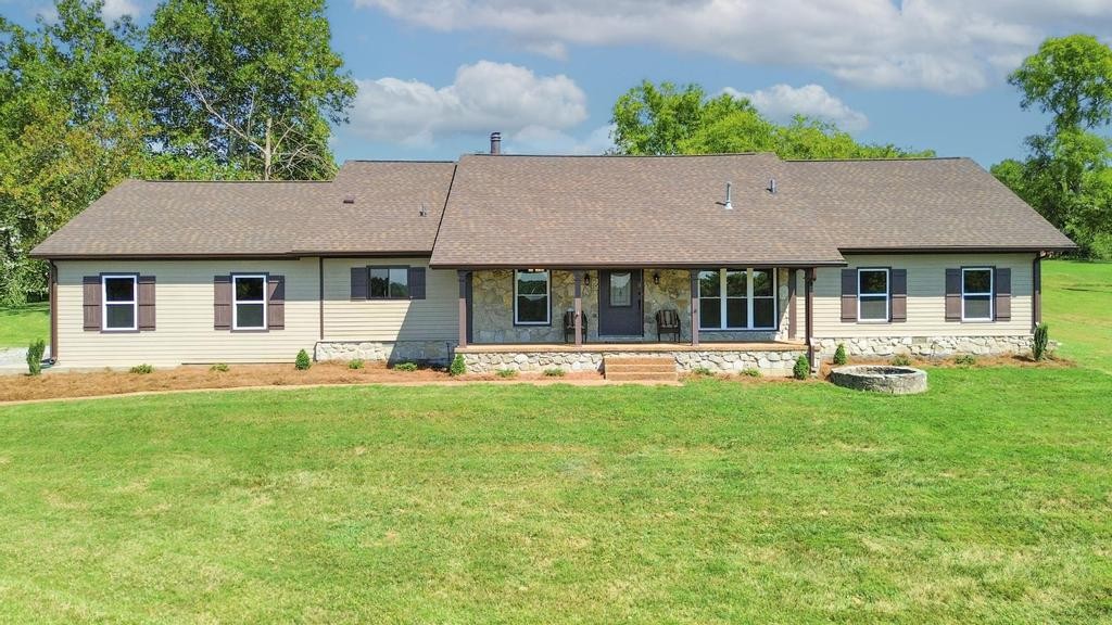 1029 Robertson Road Gallatin, TN 37066 - Photo 2 of 62 a backyard of a house with table and chairs