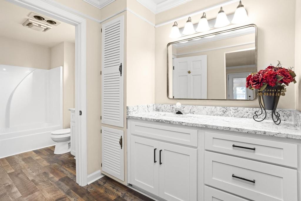 1029 Robertson Road Gallatin, TN 37066 - Photo 34 of 62 a bathroom with a granite countertop sink mirror and toilet