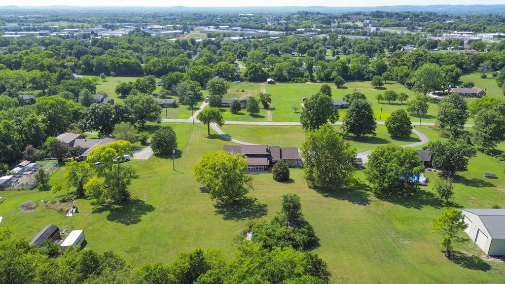 1029 Robertson Road Gallatin, TN 37066 - Photo 56 of 62 an aerial view of green landscape with trees houses and mountain view