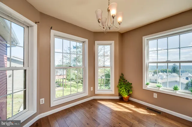 a kitchen with stainless steel appliances a refrigerator sink and cabinets
