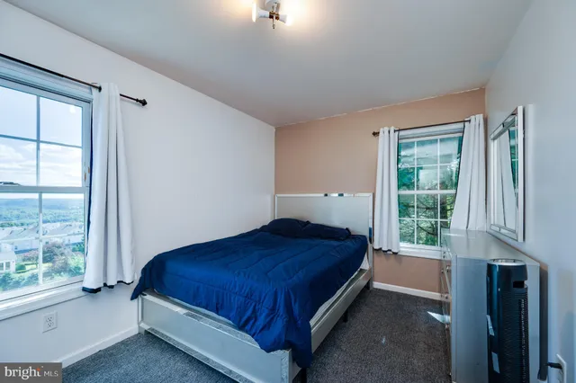 a view of a livingroom with furniture and staircase