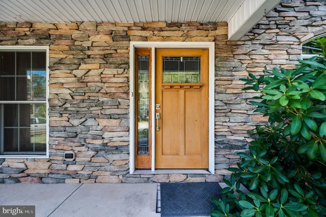 a view of entryway with wooden floor and stairs