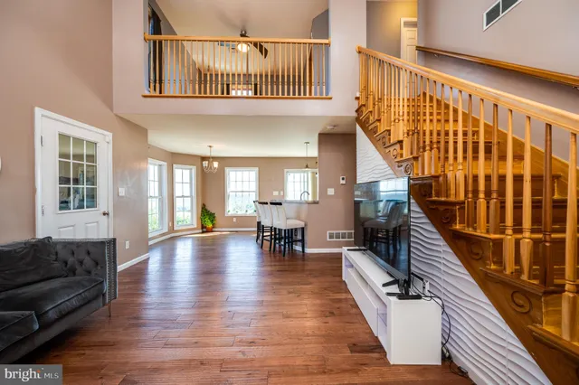 a view of a livingroom with furniture window and wooden floor