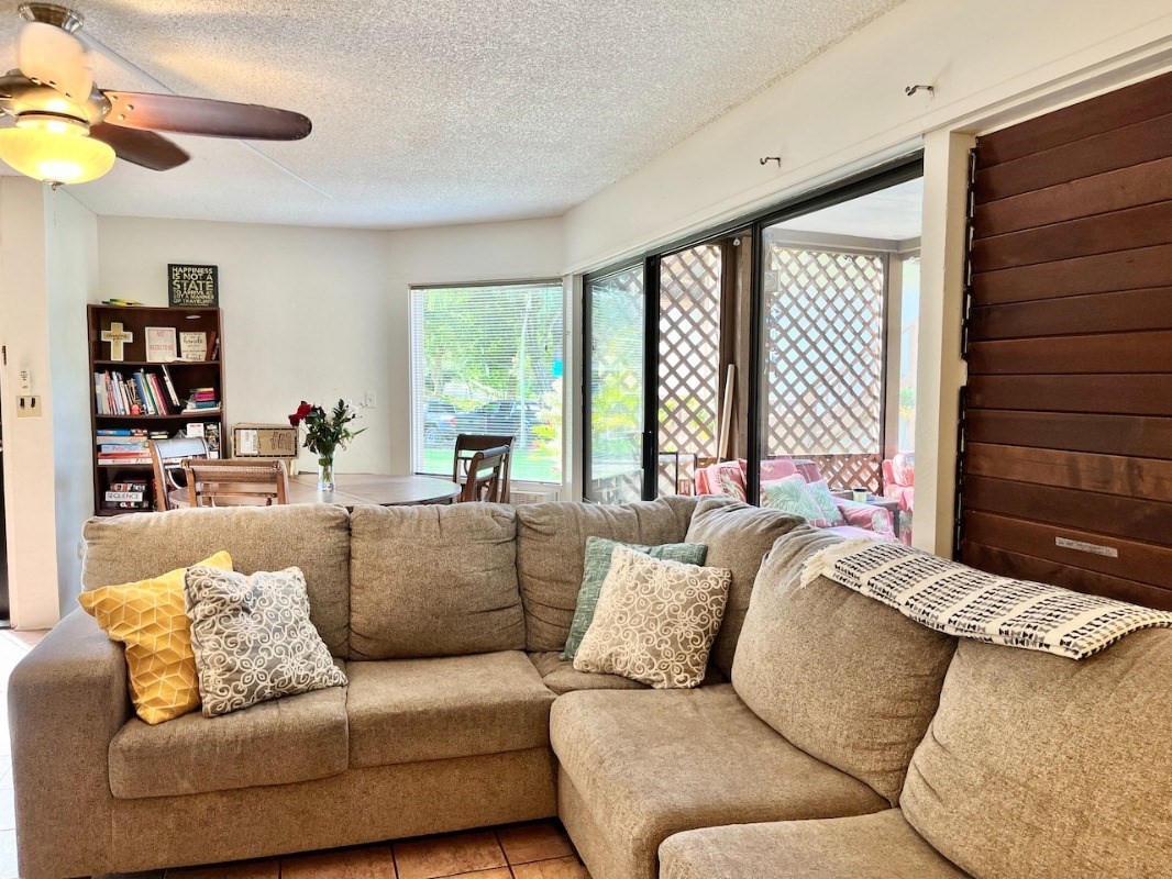 4701 Kawaihau Road, Unit L101 Kapaa, HI 96746 - Photo 2 of 12 a living room with furniture and a large window