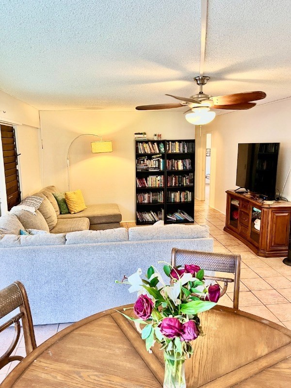 4701 Kawaihau Road, Unit L101 Kapaa, HI 96746 - Photo 3 of 12 a living room with furniture and a flat screen tv