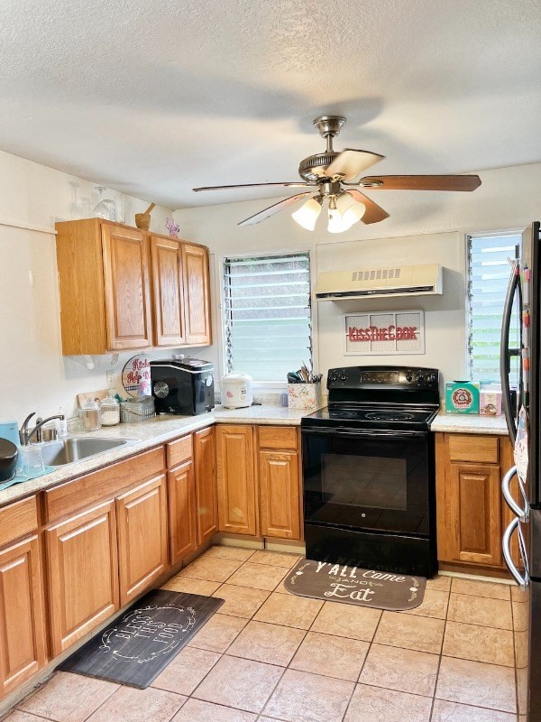 4701 Kawaihau Road, Unit L101 Kapaa, HI 96746 - Photo 4 of 12 a kitchen with stainless steel appliances a stove sink and cabinets