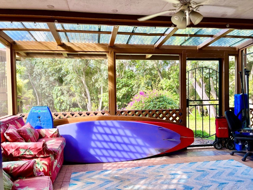 4701 Kawaihau Road, Unit L101 Kapaa, HI 96746 - Photo 5 of 12 a room with furniture and a large window