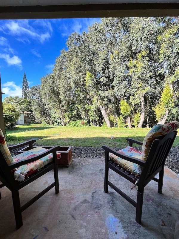 4701 Kawaihau Road, Unit L101 Kapaa, HI 96746 - Photo 7 of 12 a bench sitting in a yard with wooden fence