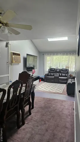 a large bedroom with a bed and a furniture