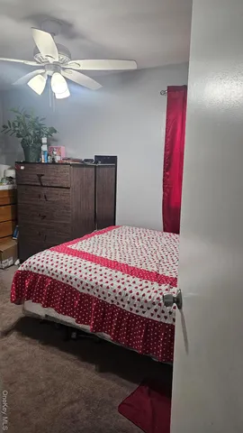 a large bed sitting in a bedroom next to a dresser