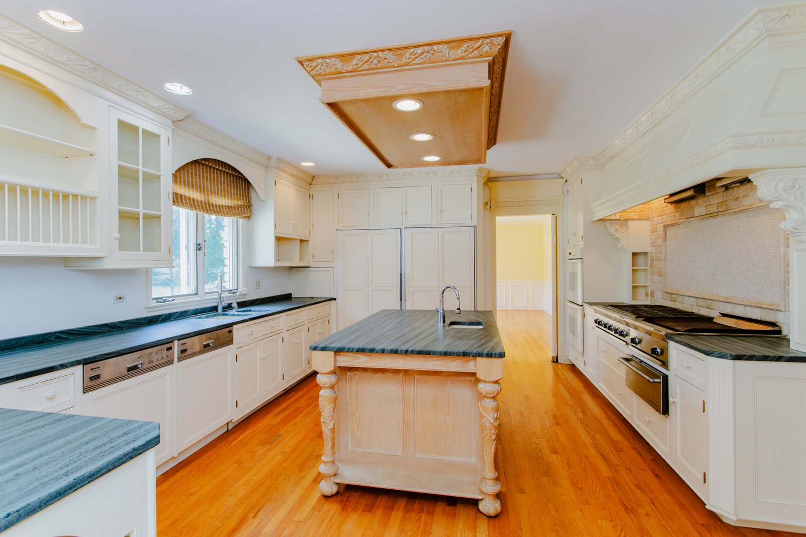 52 Aintree Road St. Charles, IL 60174 - Photo 5 of 15 a kitchen with stainless steel appliances granite countertop a sink a stove and a wooden floors