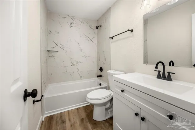 a bathroom with a double vanity sink a mirror and shower