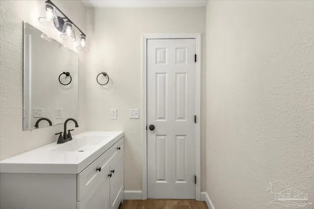 a white toilet sitting next to a bathroom sink