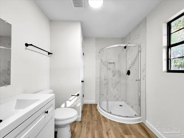 a bathroom with a sink a toilet and a bathtub