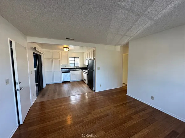 a view of a livingroom with wooden floor