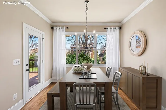 a spacious bedroom with a large bed and a chandelier