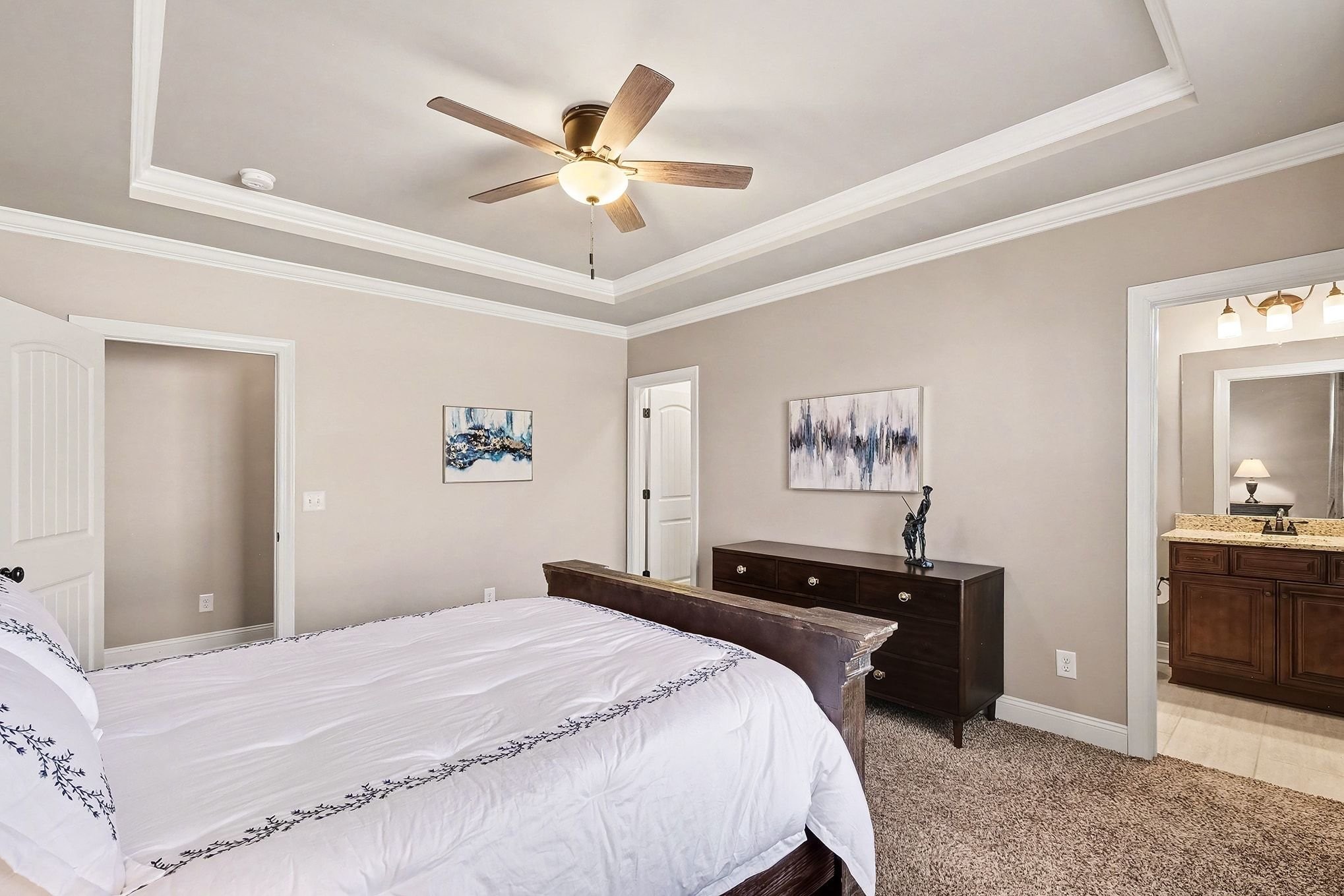 2015 Autumn Ridge Way Spring Hill, TN 37174 - Photo 25 of 42 a bedroom with a large bed and a chandelier