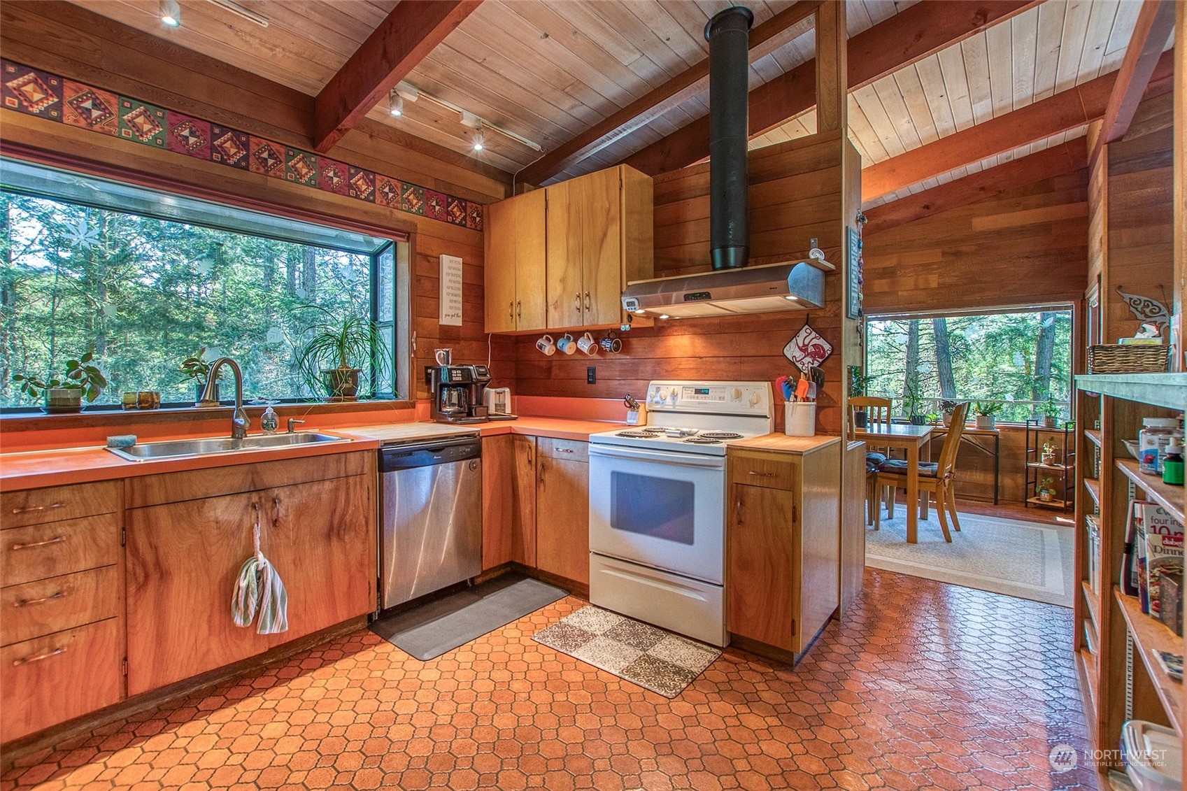 153 Exton Road Orcas Island, WA 98280 - Photo 12 of 30 a open kitchen with stainless steel appliances granite countertop a stove a sink and cabinets