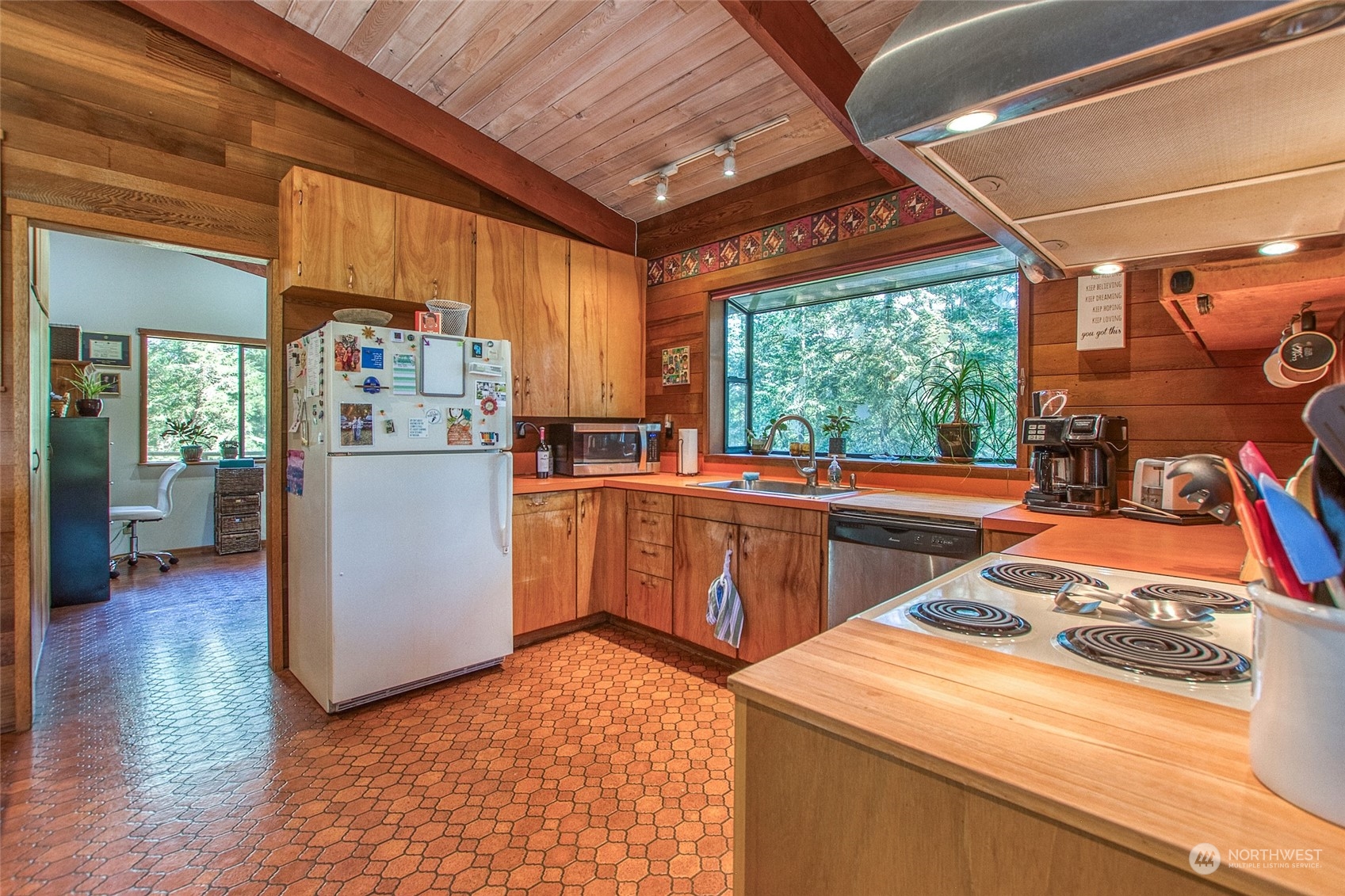 153 Exton Road Orcas Island, WA 98280 - Photo 13 of 30 a kitchen that has a sink and a refrigerator