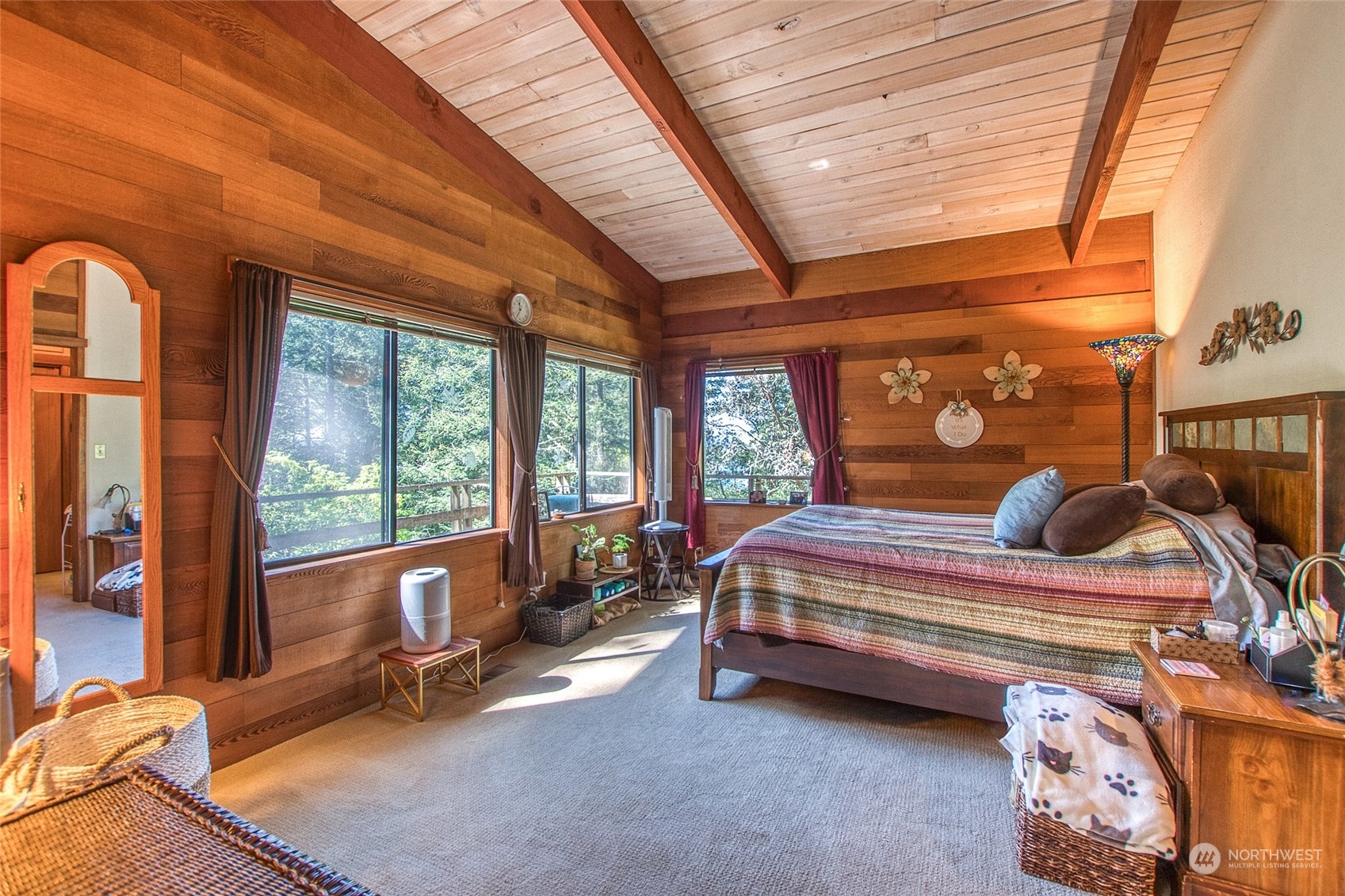 153 Exton Road Orcas Island, WA 98280 - Photo 15 of 30 a bedroom with furniture and large windows