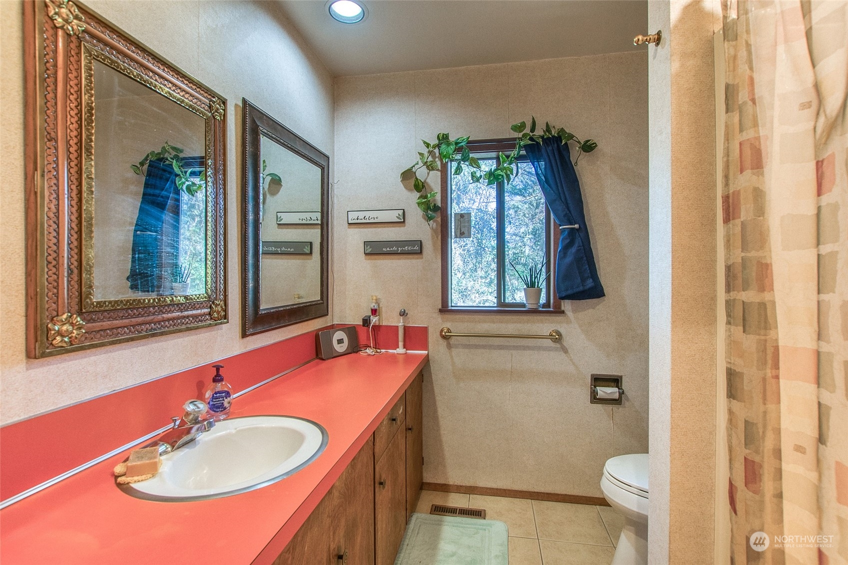 153 Exton Road Orcas Island, WA 98280 - Photo 17 of 30 a bathroom with a sink and a mirror