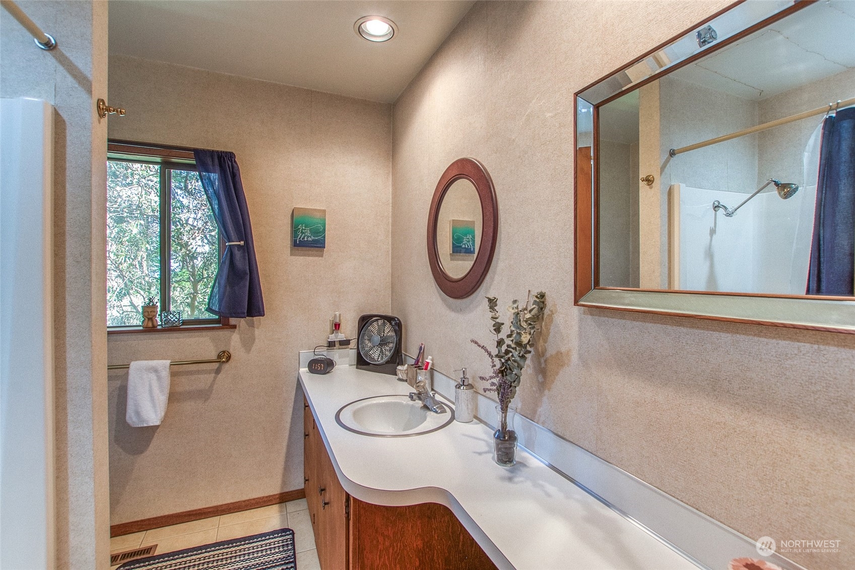 153 Exton Road Orcas Island, WA 98280 - Photo 20 of 30 a bathroom with a sink a toilet and a mirror