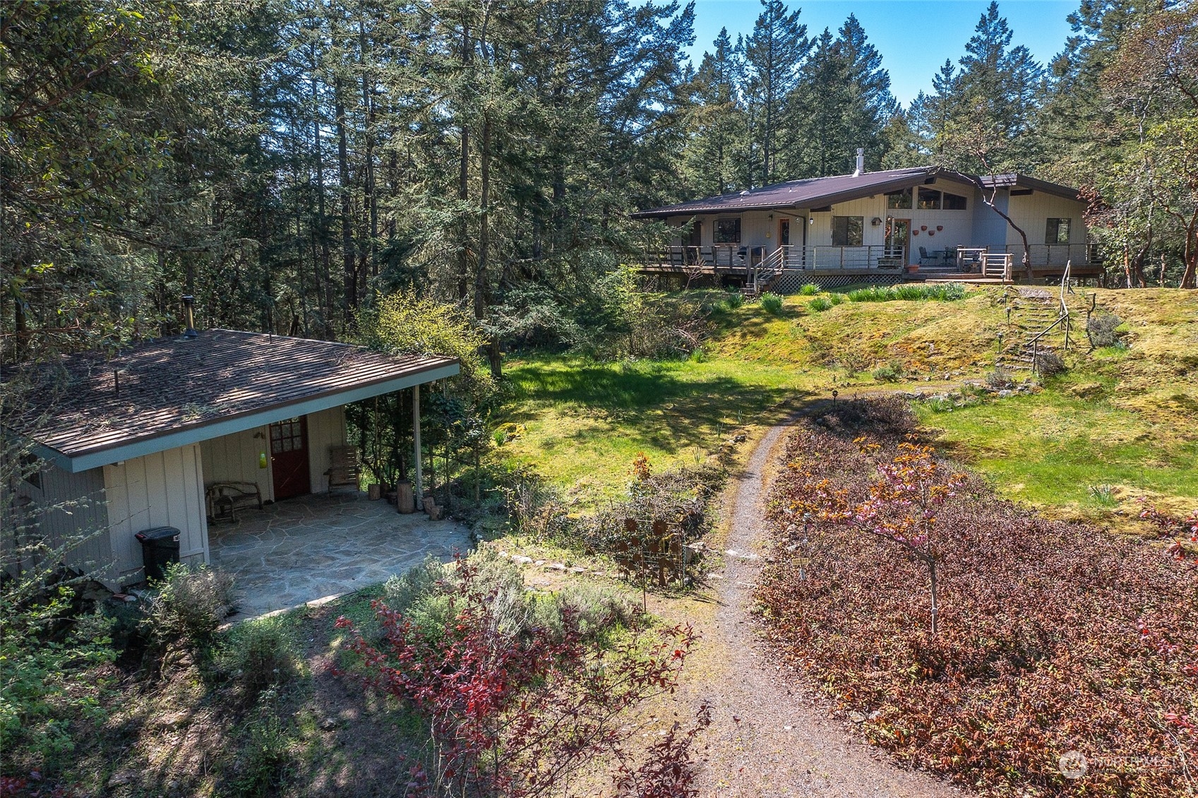 153 Exton Road Orcas Island, WA 98280 - Photo 2 of 30 a view of a house with a yard