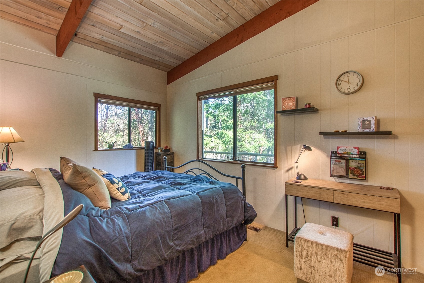 153 Exton Road Orcas Island, WA 98280 - Photo 21 of 30 a bedroom with a bed and windows