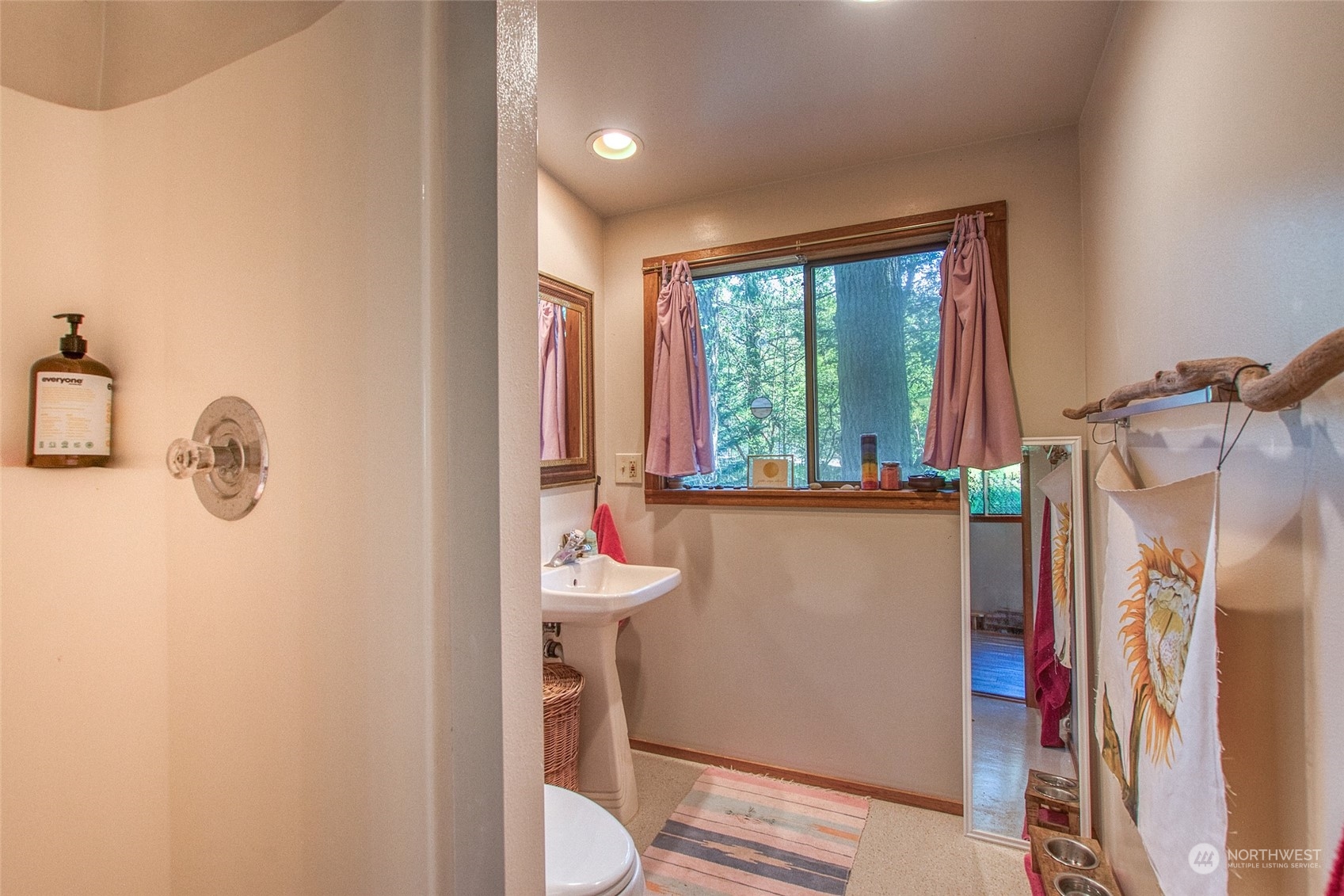 153 Exton Road Orcas Island, WA 98280 - Photo 24 of 30 a bathroom with a toilet sink and mirror