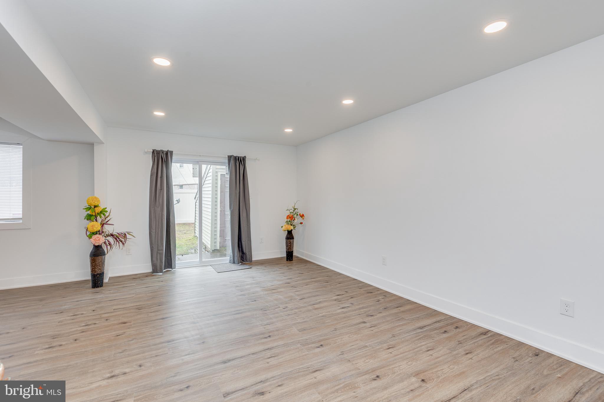 705 Mason Run Pine Hill, NJ 08021 - Photo 12 of 33 a view of an empty room with wooden floor and a window