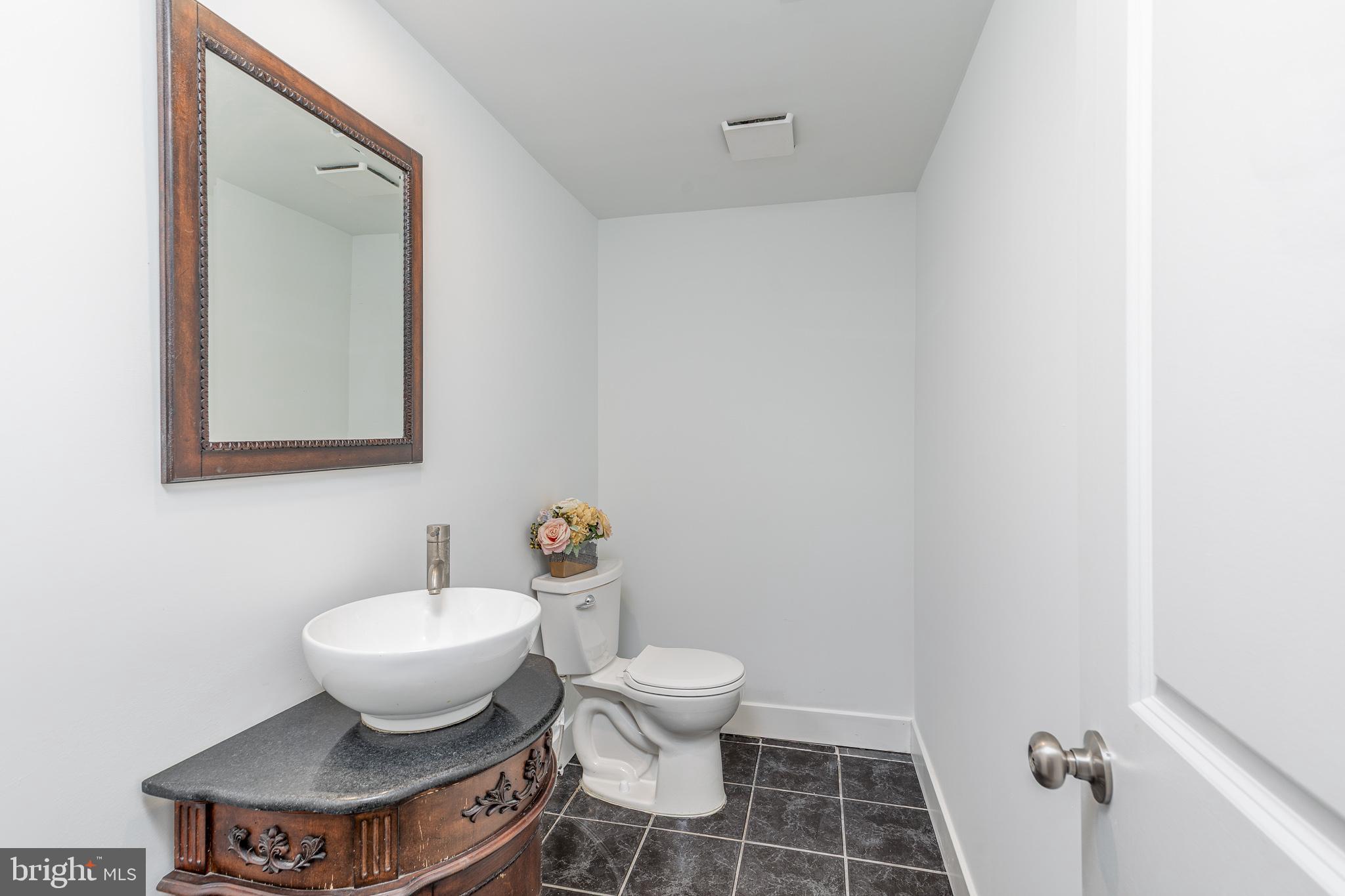 705 Mason Run Pine Hill, NJ 08021 - Photo 17 of 33 a bathroom with a toilet sink and mirror