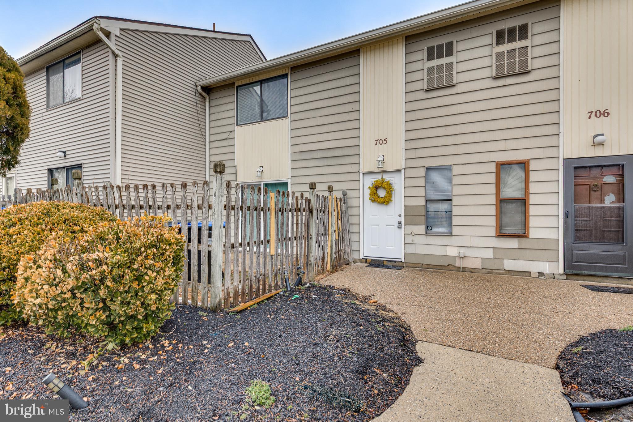 705 Mason Run Pine Hill, NJ 08021 - Photo 2 of 33 a front view of a house with a garage