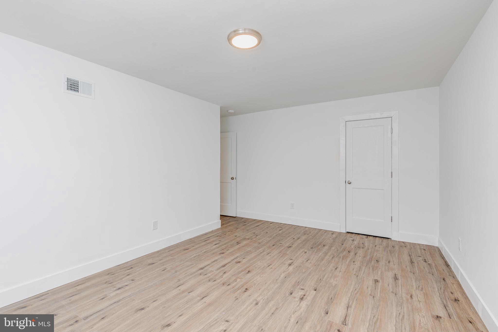 705 Mason Run Pine Hill, NJ 08021 - Photo 21 of 33 a view of an empty room with wooden floor
