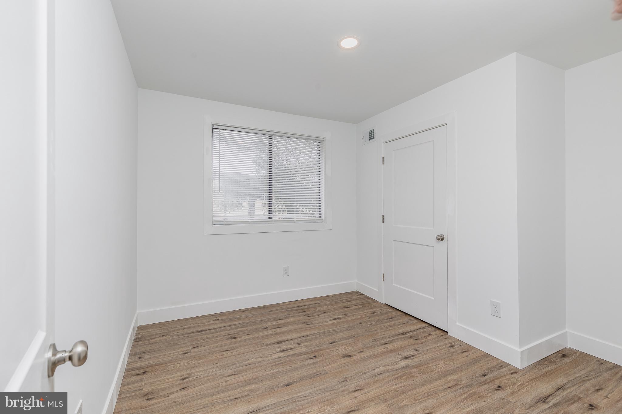 705 Mason Run Pine Hill, NJ 08021 - Photo 24 of 33 an empty room with wooden floor and windows
