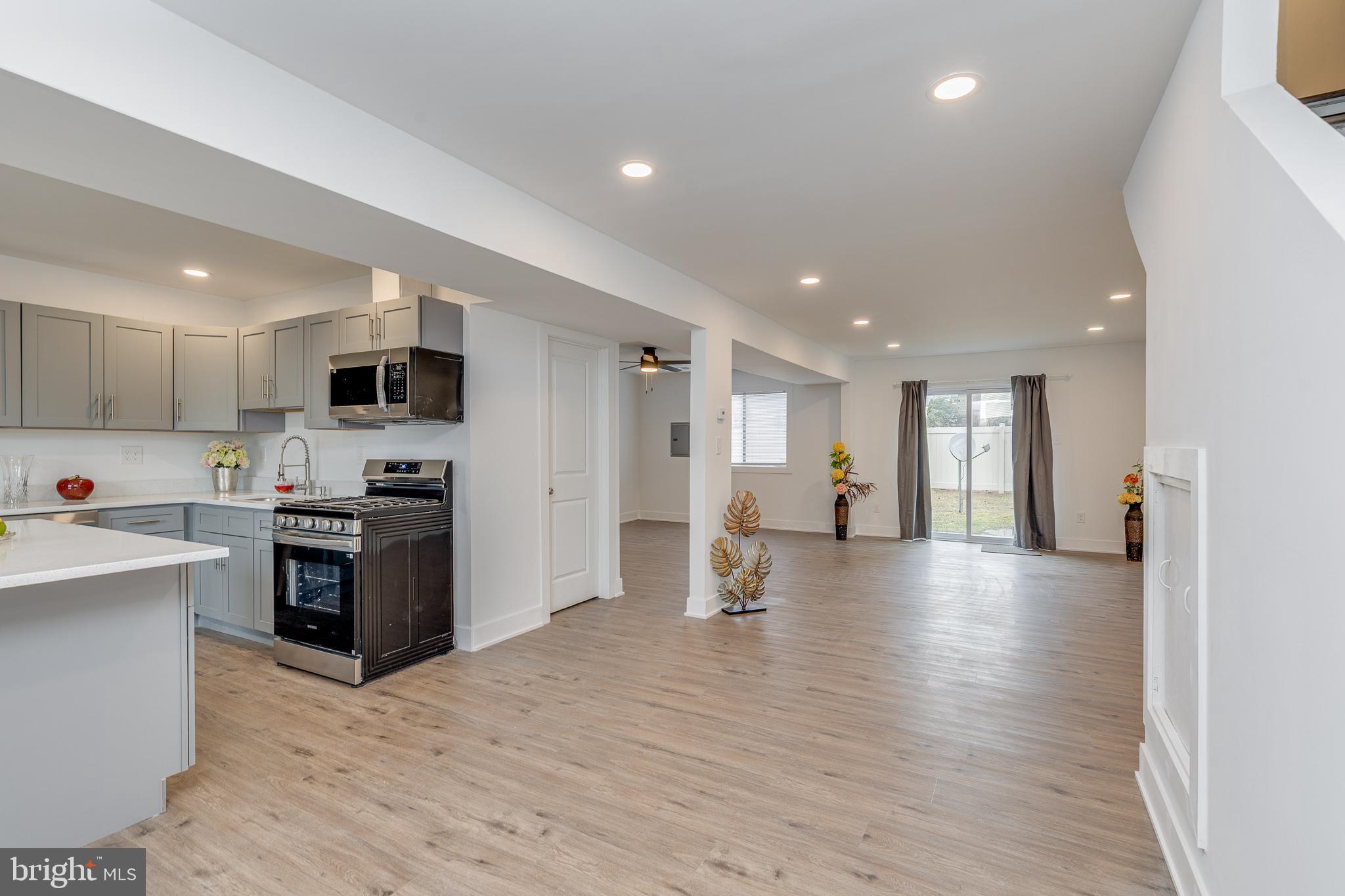 705 Mason Run Pine Hill, NJ 08021 - Photo 5 of 33 a view of kitchen with refrigerator stove microwave and cabinets