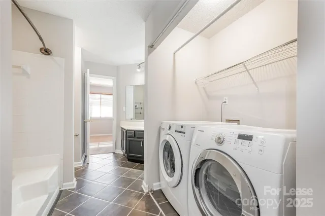 a view of a hallway with washer and dryer
