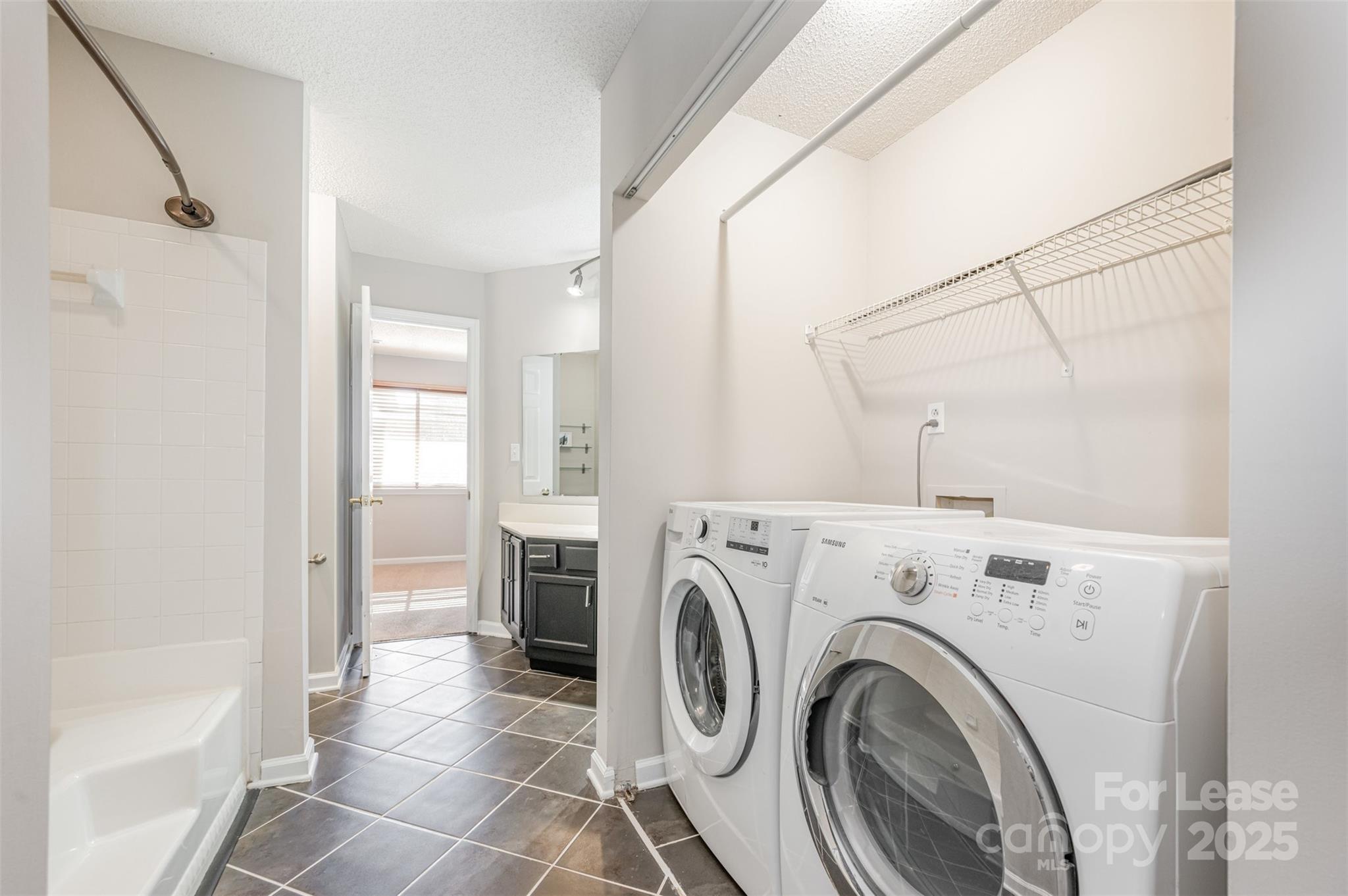 2555 Stockbridge Drive, Unit C Charlotte, NC 28210 - Photo 11 of 19 a view of a hallway with washer and dryer