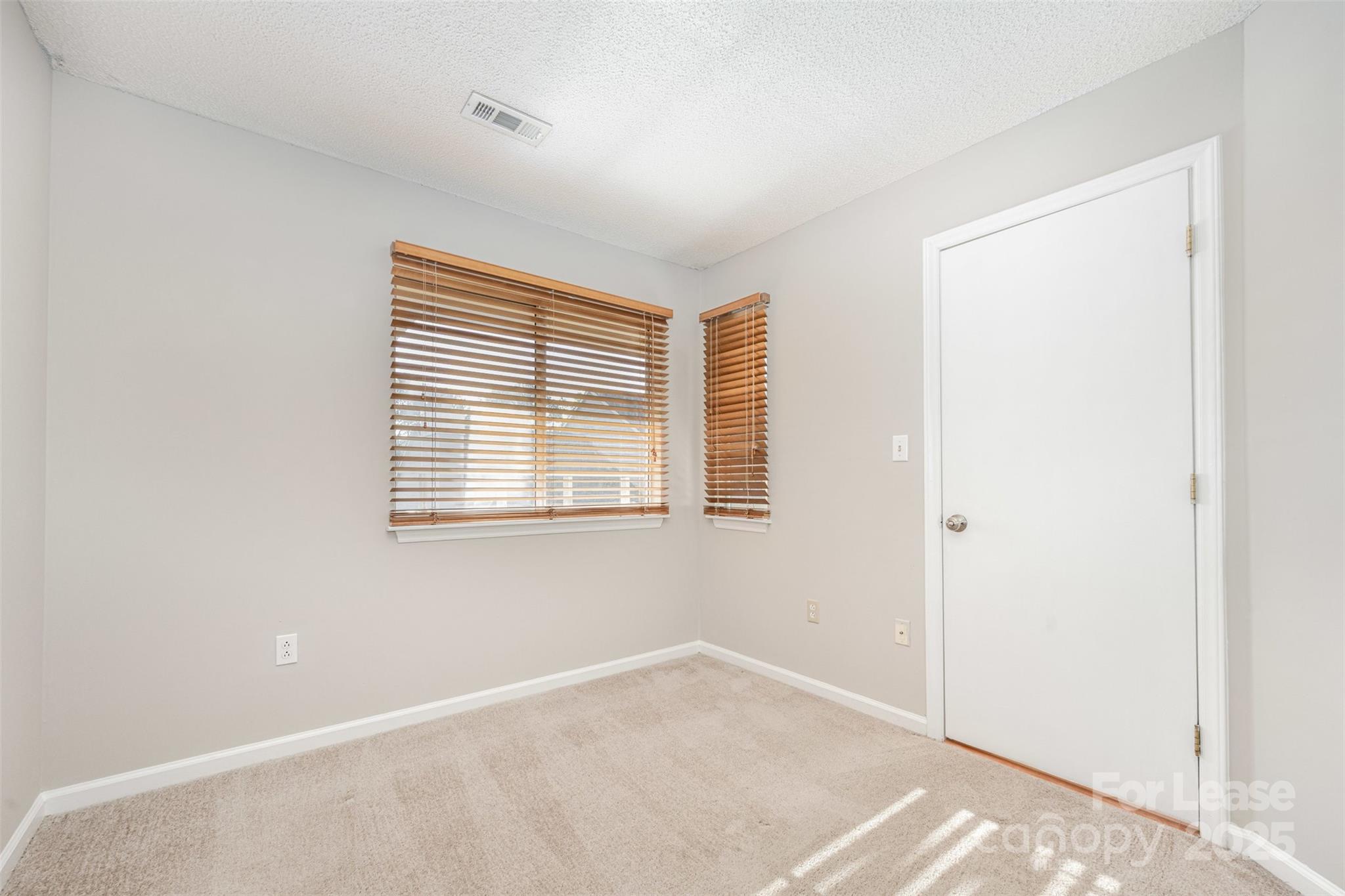 2555 Stockbridge Drive, Unit C Charlotte, NC 28210 - Photo 15 of 19 a view of an empty room with a window
