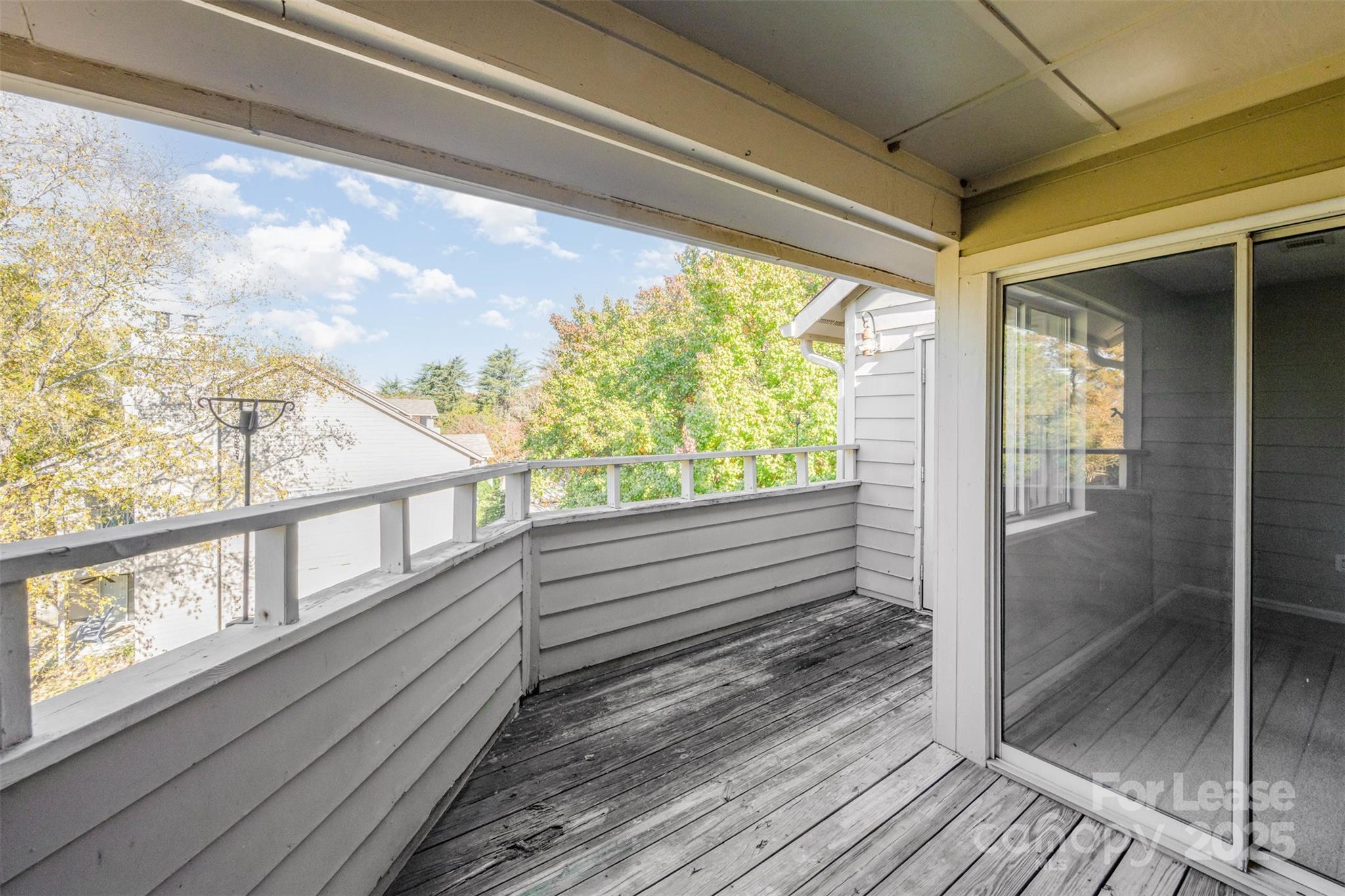 2555 Stockbridge Drive, Unit C Charlotte, NC 28210 - Photo 16 of 19 a view of a balcony with wooden floor