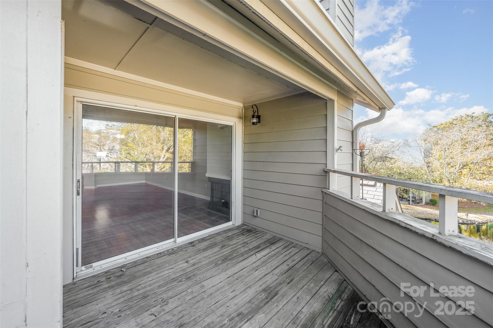 2555 Stockbridge Drive, Unit C Charlotte, NC 28210 - Photo 17 of 19 a view of a balcony with wooden floor