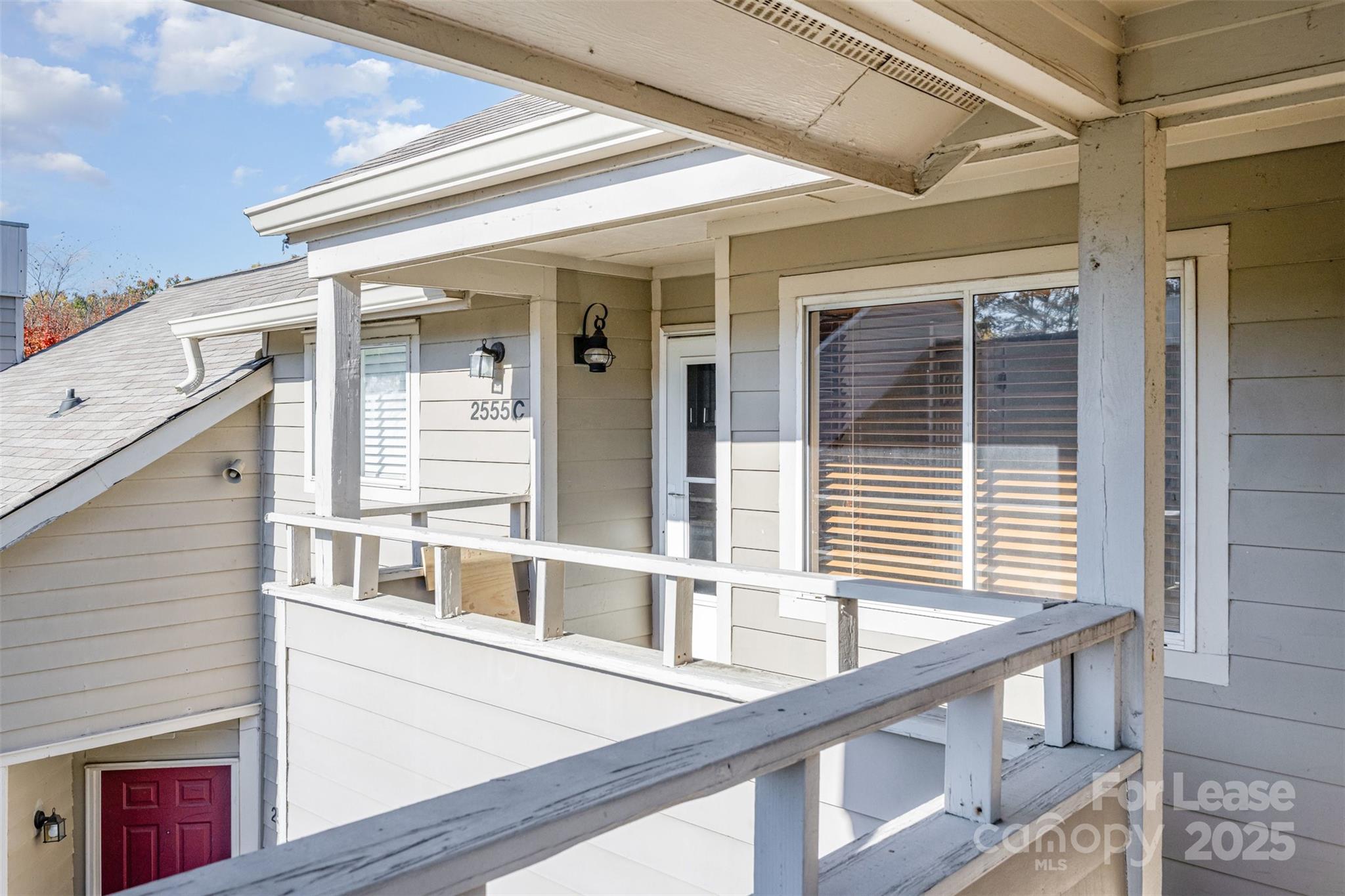 2555 Stockbridge Drive, Unit C Charlotte, NC 28210 - Photo 2 of 19 a view of a balcony and window