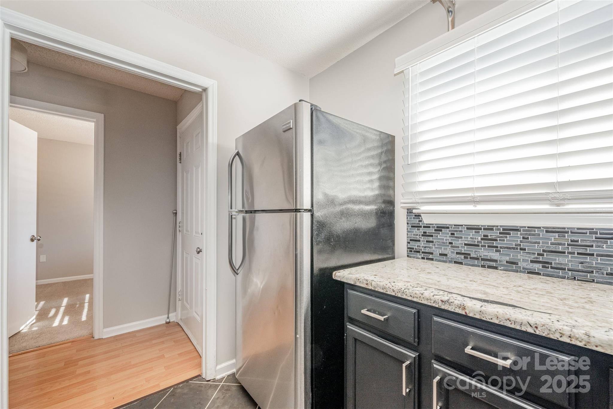2555 Stockbridge Drive, Unit C Charlotte, NC 28210 - Photo 6 of 19 a kitchen with a refrigerator and a sink