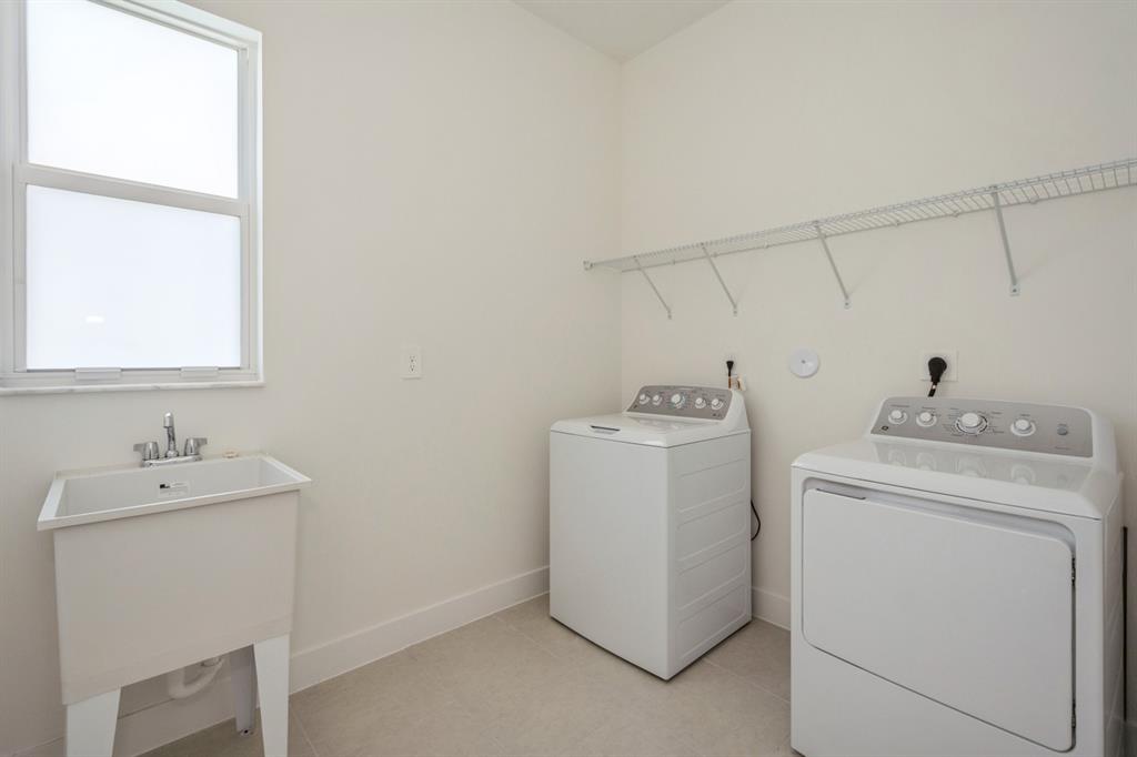 4385 Southwest 123rd Avenue Davie, FL 33330 - Photo 12 of 46 a utility room with dryer and washer
