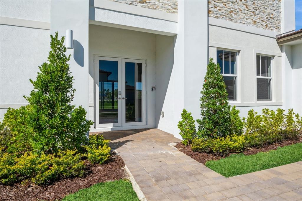 4385 Southwest 123rd Avenue Davie, FL 33330 - Photo 2 of 46 front view of a house with a yard