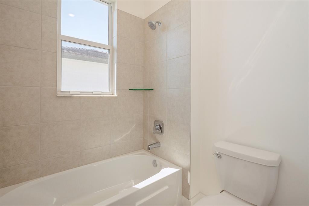 4385 Southwest 123rd Avenue Davie, FL 33330 - Photo 25 of 46 a white bath tub sitting next to a shower