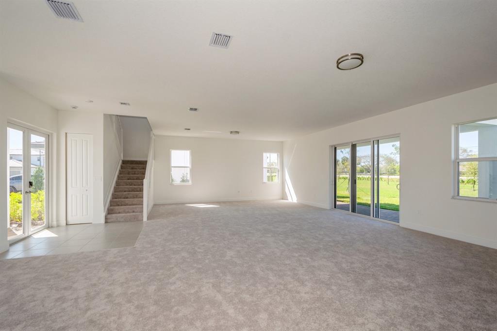4385 Southwest 123rd Avenue Davie, FL 33330 - Photo 4 of 46 a view of an empty room with a fireplace and a window
