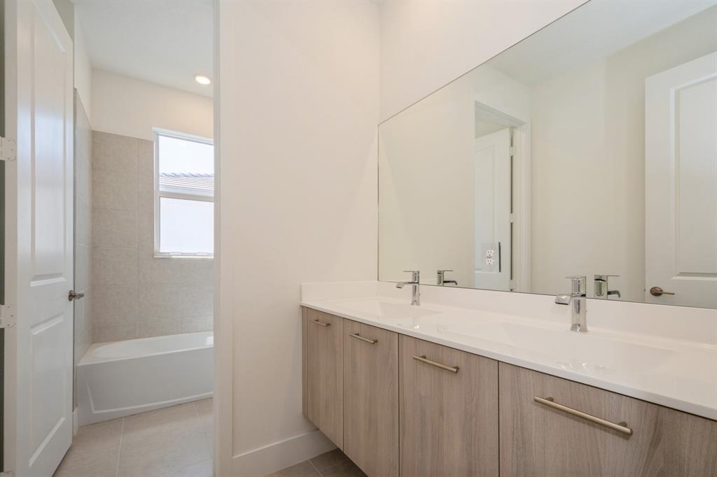 4385 Southwest 123rd Avenue Davie, FL 33330 - Photo 46 of 46 a bathroom with a double vanity sink and a mirror