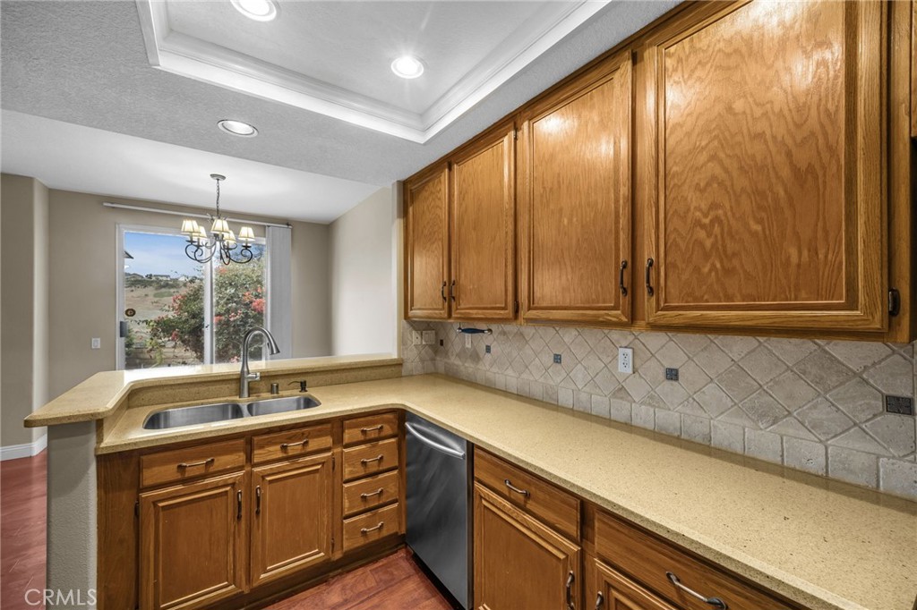 28677 La Azteca Laguna Niguel, CA 92677 - Photo 17 of 36 a kitchen with a sink and large window
