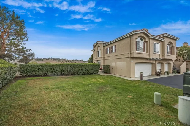 an aerial view of a house with a garden